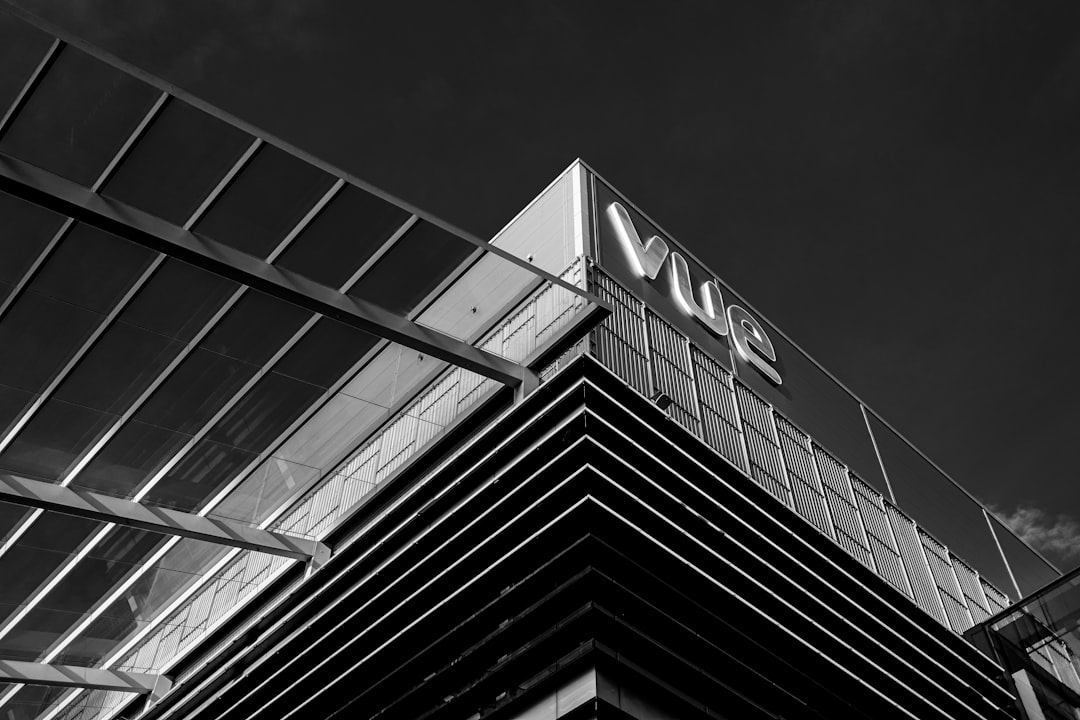 Modern building with vue logo against dark sky