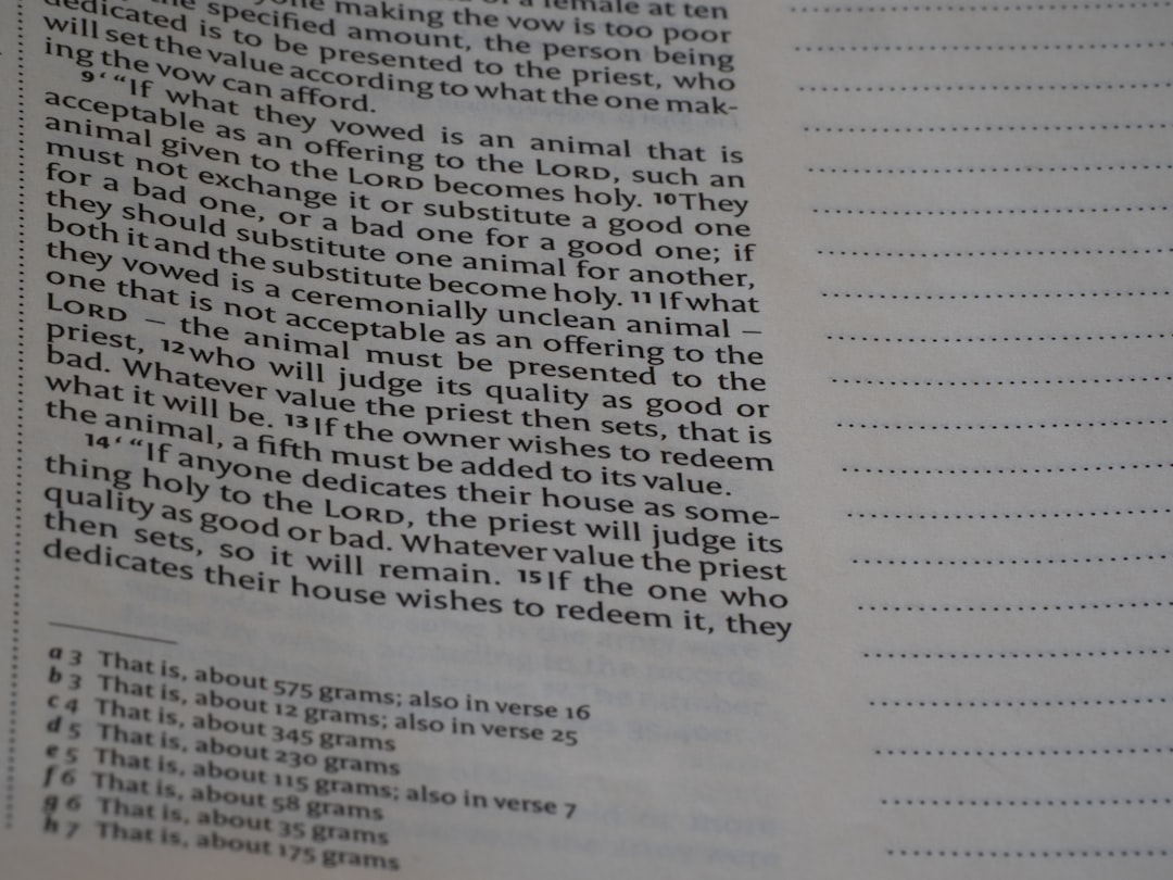 A book page with printed text and blank lined paper