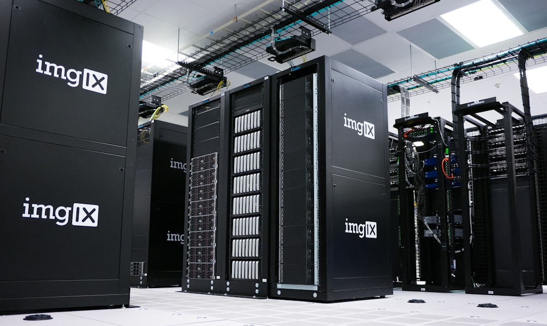Rows of black server racks with white logos in a data center