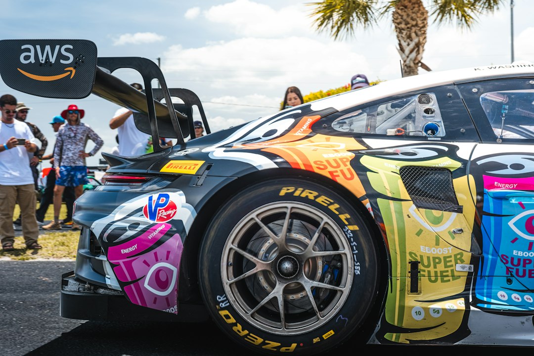 Race car with cartoon graphics and aws logo
