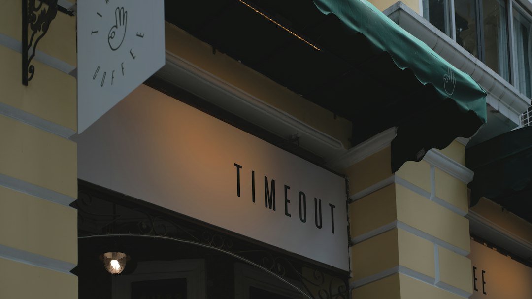 white and black wooden wall mounted signage