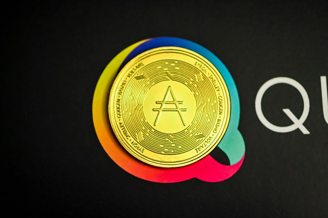 a close up of a gold coin on a black background