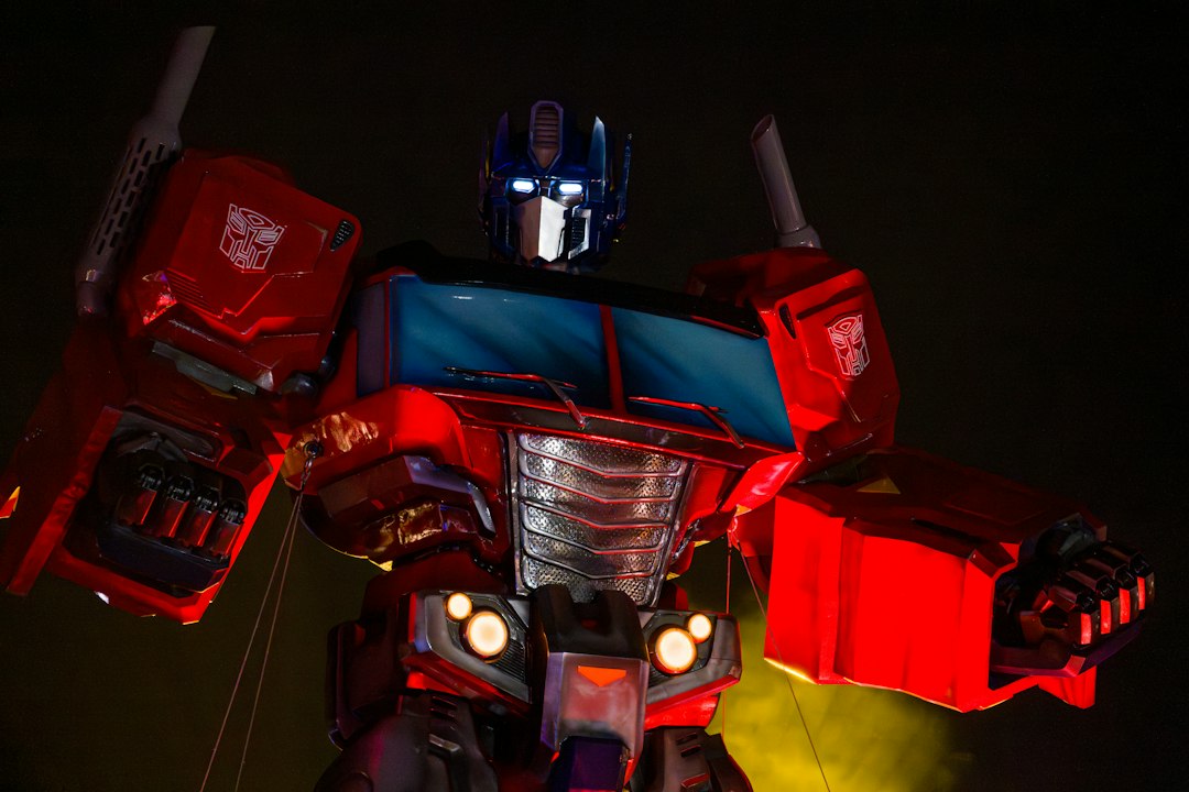 A detailed red and blue robot with glowing eyes