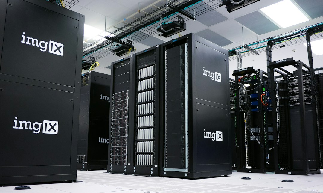 Rows of black server racks with white logos in a data center